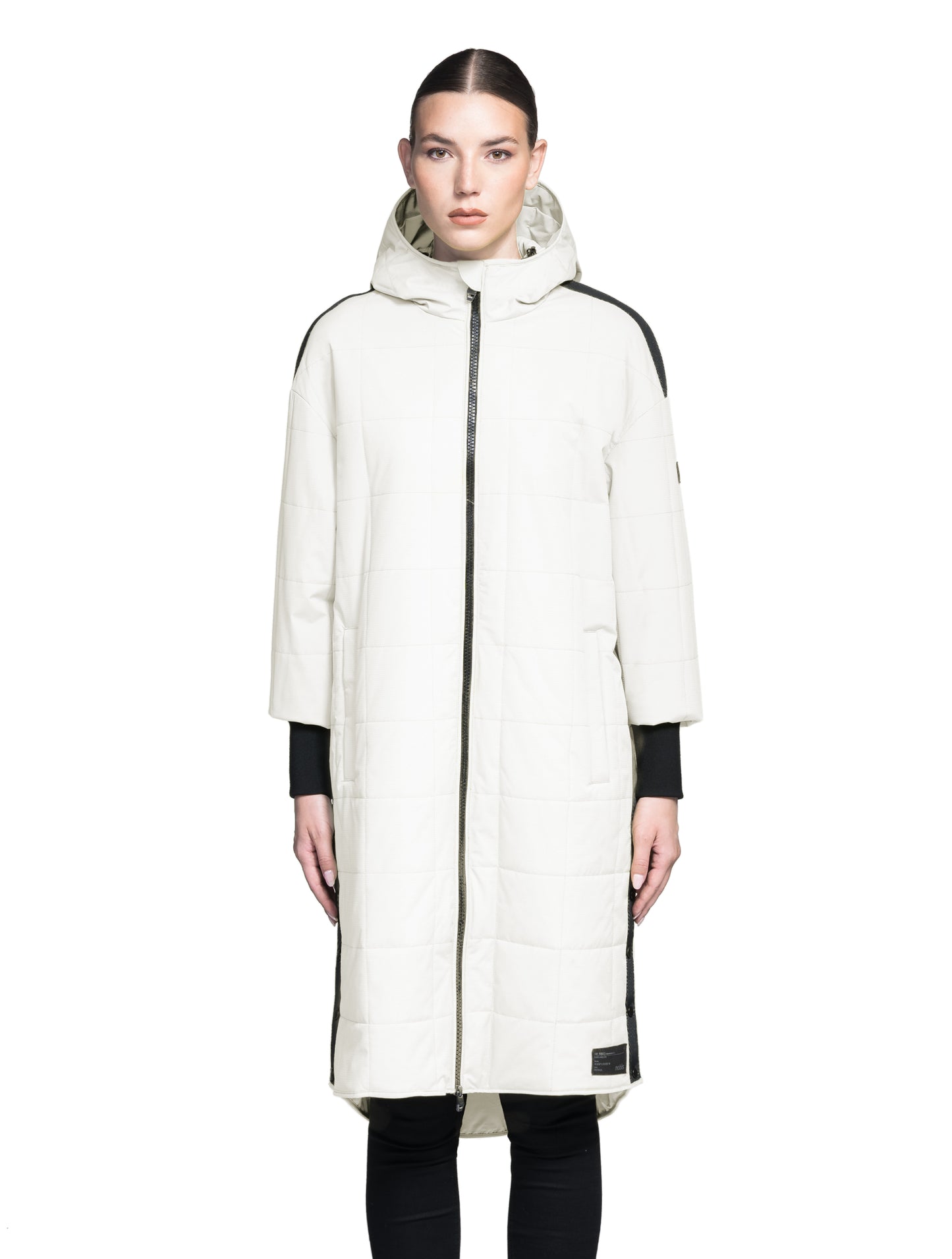 Radar Women's Performance Long Midlayer Jacket in long length, premium stretch ripstop and stretch Toray nylon fabrication, premium 4-way stretch, water resistant Primaloft Gold Insulation Active+, non-removable hood with adjustable draw cord, 2-way branded zipper at centre front, single welt pockets with magnetic closure at hips, elongated ribbed cuffs, grosgrain ribbon detail at shoulder and side seams, and snap closure side seam vent, in Chal