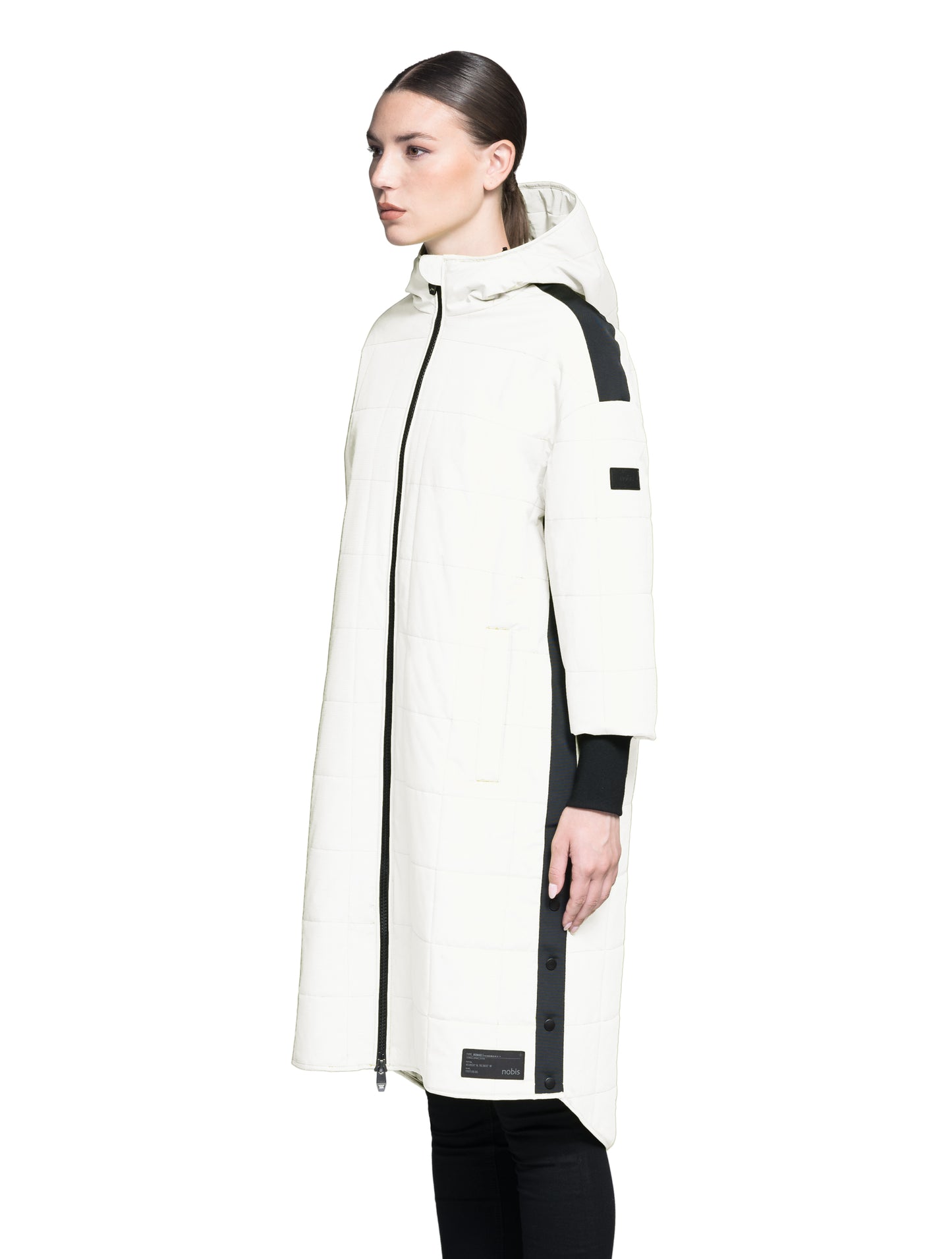 Radar Women's Performance Long Midlayer Jacket in long length, premium stretch ripstop and stretch Toray nylon fabrication, premium 4-way stretch, water resistant Primaloft Gold Insulation Active+, non-removable hood with adjustable draw cord, 2-way branded zipper at centre front, single welt pockets with magnetic closure at hips, elongated ribbed cuffs, grosgrain ribbon detail at shoulder and side seams, and snap closure side seam vent, in Chal