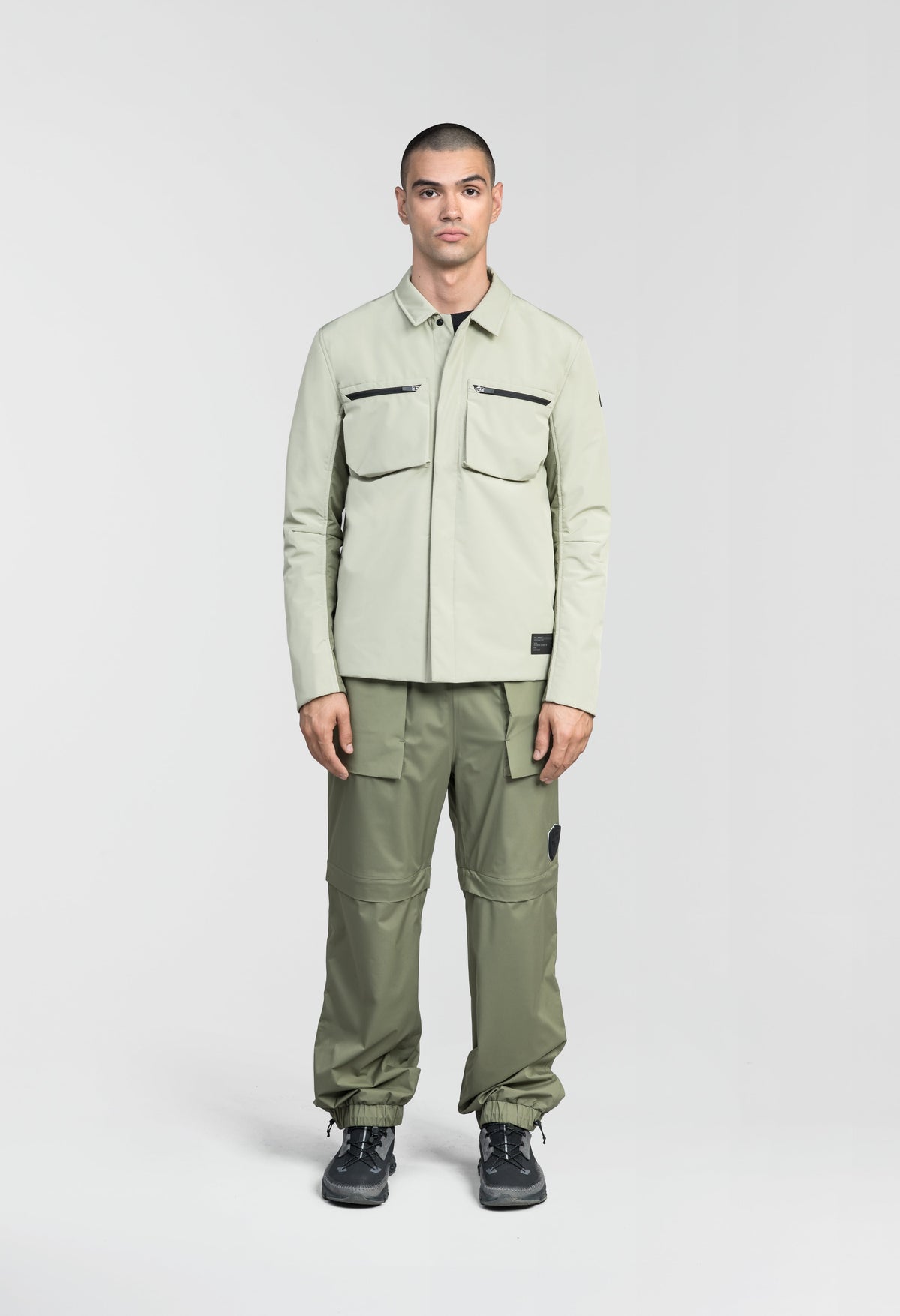 Ander Men's Mid Layer Shirt in hip length, PrimaLoft Gold Insulation Active+, 3-Ply Micro Denier front and 4-Way Durable Stretch Weave back, zipper chest pockets, snap button wind flap, and snap button cuffs, in Tea/Clover