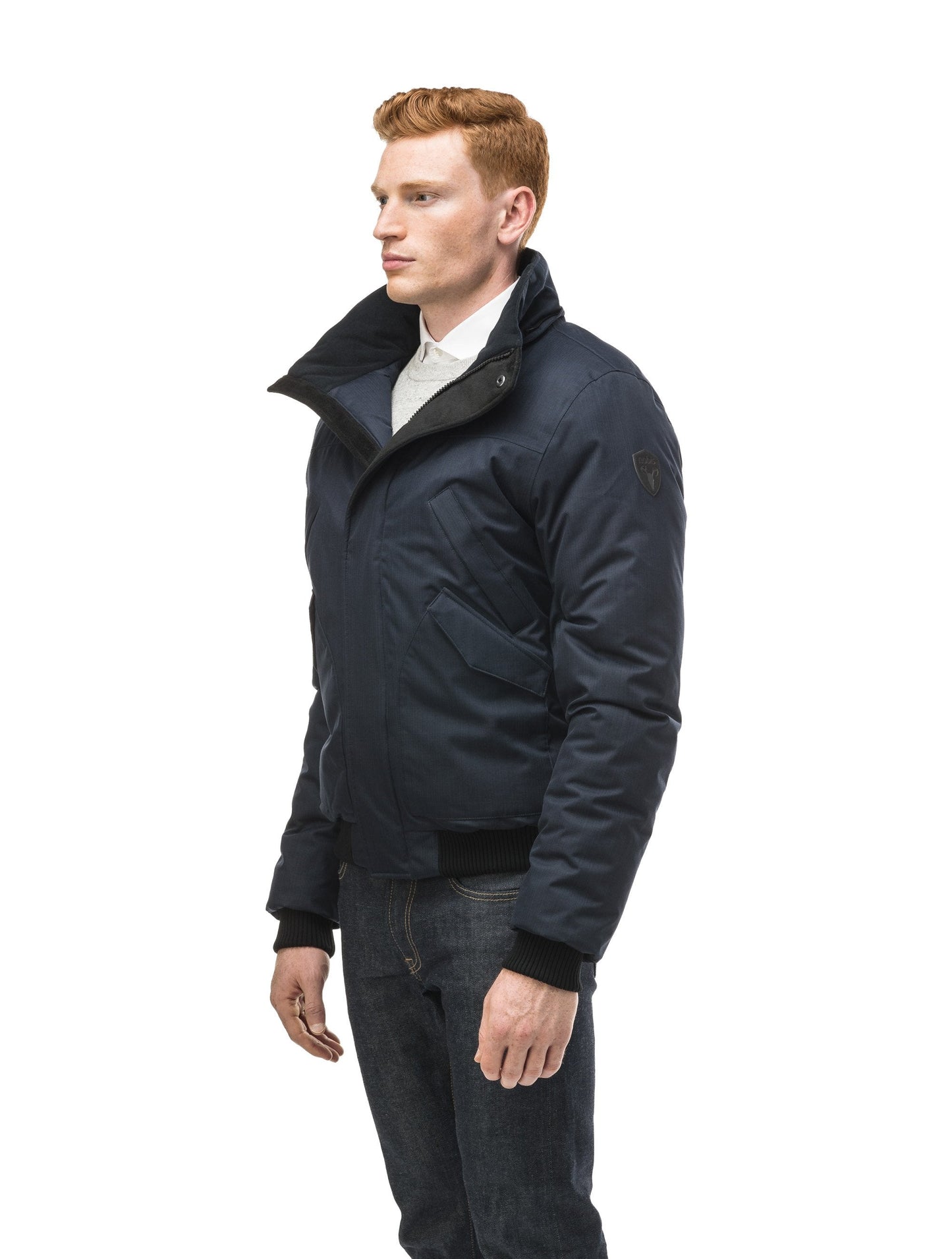 Men's classic down filled bomber jacket with a down filledÃƒÆ’Ã†â€™Ãƒâ€ Ã¢â‚¬â„¢ÃƒÆ’Ã¢â‚¬Â ÃƒÂ¢Ã¢â€šÂ¬Ã¢â€žÂ¢ÃƒÆ’Ã†â€™Ãƒâ€šÃ‚Â¢ÃƒÆ’Ã‚Â¢ÃƒÂ¢Ã¢â€šÂ¬Ã…Â¡Ãƒâ€šÃ‚Â¬ÃƒÆ’Ã¢â‚¬Â¦Ãƒâ€šÃ‚Â¡ÃƒÆ’Ã†â€™Ãƒâ€ Ã¢â‚¬â„¢ÃƒÆ’Ã‚Â¢ÃƒÂ¢Ã¢â‚¬Å¡Ã‚Â¬Ãƒâ€¦Ã‚Â¡ÃƒÆ’Ã†â€™ÃƒÂ¢Ã¢â€šÂ¬Ã…Â¡ÃƒÆ’Ã¢â‚¬Å¡Ãƒâ€šÃ‚Â hood that features a removable coyote fur trim and concealed moldable framing wire in Navy