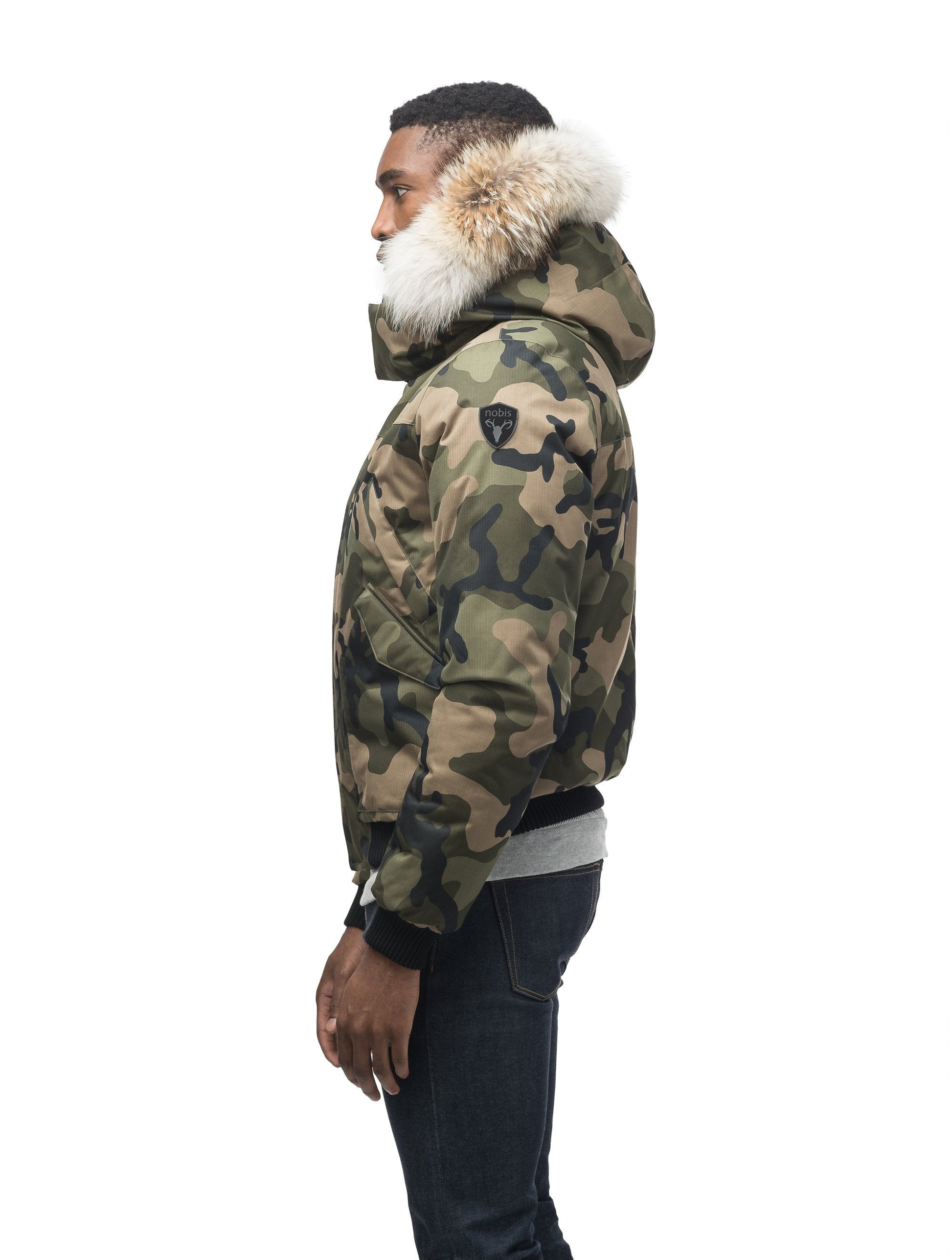 Men's classic down filled bomber jacket with a down filledÃƒÆ’Ã†â€™Ãƒâ€ Ã¢â‚¬â„¢ÃƒÆ’Ã¢â‚¬Â ÃƒÂ¢Ã¢â€šÂ¬Ã¢â€žÂ¢ÃƒÆ’Ã†â€™Ãƒâ€šÃ‚Â¢ÃƒÆ’Ã‚Â¢ÃƒÂ¢Ã¢â€šÂ¬Ã…Â¡Ãƒâ€šÃ‚Â¬ÃƒÆ’Ã¢â‚¬Â¦Ãƒâ€šÃ‚Â¡ÃƒÆ’Ã†â€™Ãƒâ€ Ã¢â‚¬â„¢ÃƒÆ’Ã‚Â¢ÃƒÂ¢Ã¢â‚¬Å¡Ã‚Â¬Ãƒâ€¦Ã‚Â¡ÃƒÆ’Ã†â€™ÃƒÂ¢Ã¢â€šÂ¬Ã…Â¡ÃƒÆ’Ã¢â‚¬Å¡Ãƒâ€šÃ‚Â hood that features a removable coyote fur trim and concealed moldable framing wire in Camo