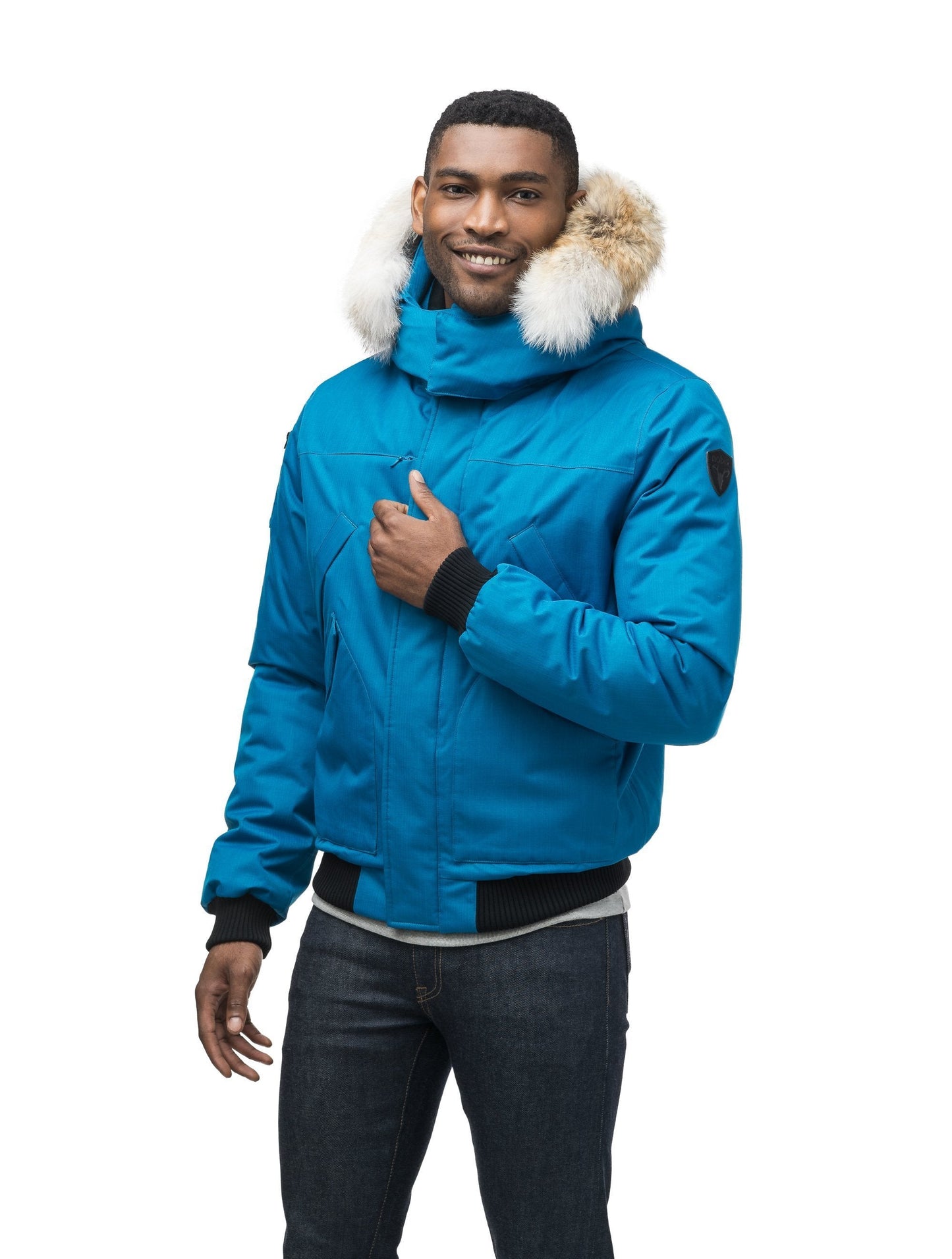 Men's classic down filled bomber jacket with a down filledÃƒÆ’Ã†â€™Ãƒâ€ Ã¢â‚¬â„¢ÃƒÆ’Ã¢â‚¬Â ÃƒÂ¢Ã¢â€šÂ¬Ã¢â€žÂ¢ÃƒÆ’Ã†â€™Ãƒâ€šÃ‚Â¢ÃƒÆ’Ã‚Â¢ÃƒÂ¢Ã¢â€šÂ¬Ã…Â¡Ãƒâ€šÃ‚Â¬ÃƒÆ’Ã¢â‚¬Â¦Ãƒâ€šÃ‚Â¡ÃƒÆ’Ã†â€™Ãƒâ€ Ã¢â‚¬â„¢ÃƒÆ’Ã‚Â¢ÃƒÂ¢Ã¢â‚¬Å¡Ã‚Â¬Ãƒâ€¦Ã‚Â¡ÃƒÆ’Ã†â€™ÃƒÂ¢Ã¢â€šÂ¬Ã…Â¡ÃƒÆ’Ã¢â‚¬Å¡Ãƒâ€šÃ‚Â hood that features a removable coyote fur trim and concealed moldable framing wire in Sea Blue