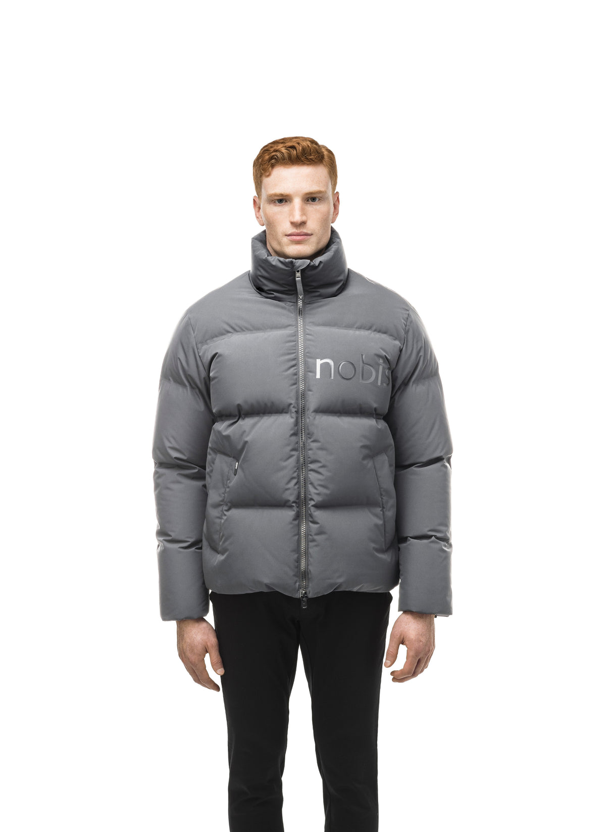 Men's puffer jacket with a minimalist modern design; featuring graphic details like oversized tonal branding, an exposed zipper, and seamless puffer channels in Concrete