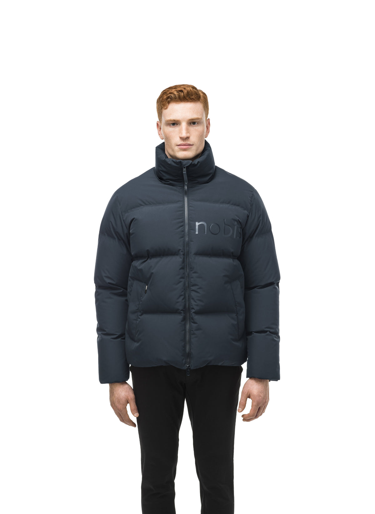 Men's puffer jacket with a minimalist modern design; featuring graphic details like oversized tonal branding, an exposed zipper, and seamless puffer channels in Midnight Blue