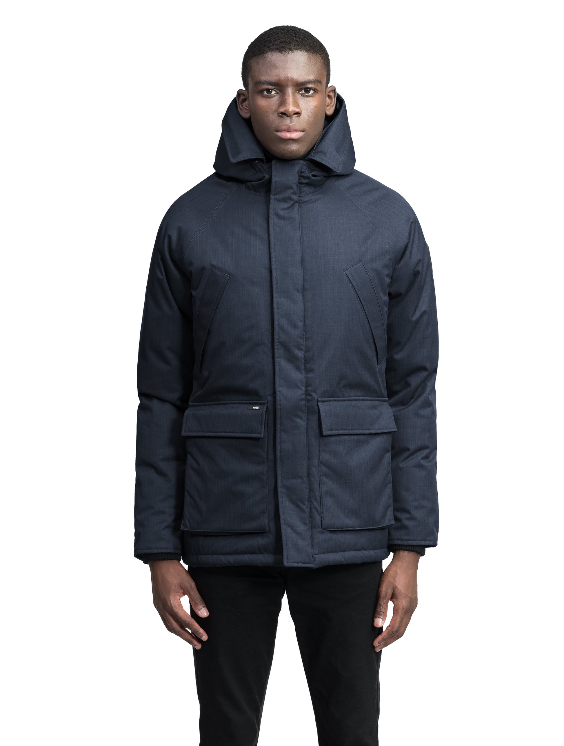 Heritage Furless Men's Parka in hip length, Canadian white duck down insulation, non-removable hood, front zipper with magnetic placket, chest hand warmer pockets, waist flap pockets, and elastic cuffs, in Navy