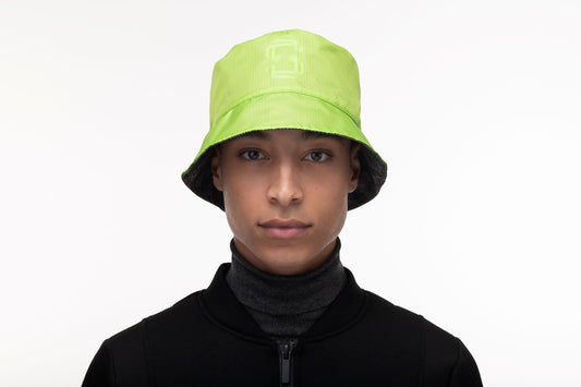 Unisex reversible bucket hat with one side in camouflage and "MAFUZZY" printed on the rim, and the reversed side with the "S" logo printed on the crown in tonal Greenery + Greenery