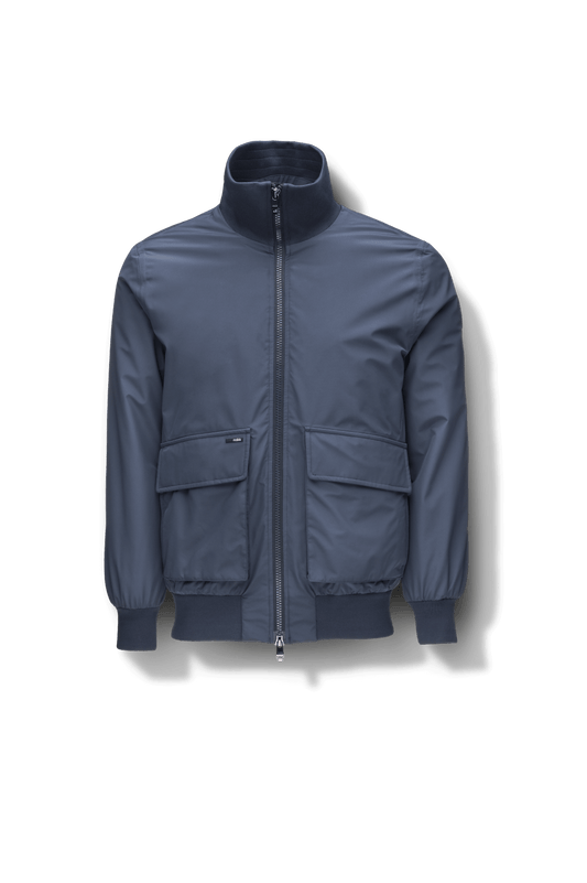 Flint Men's Tailored Rib Collar Jacket in hip length, premium 3-ply Micro Denier fabrication, premium 4-way stretch, water resistant Primaloft Gold Insulation Active +, flap pockets with magnetic closure at waist, side entry pockets at waist, ribbed sleeve cuffs, two-way branded zipper at centre front, box pleat detailing at centre back, large interior zipper pocket, and interior button pocket at left chest, in Marine + Marine