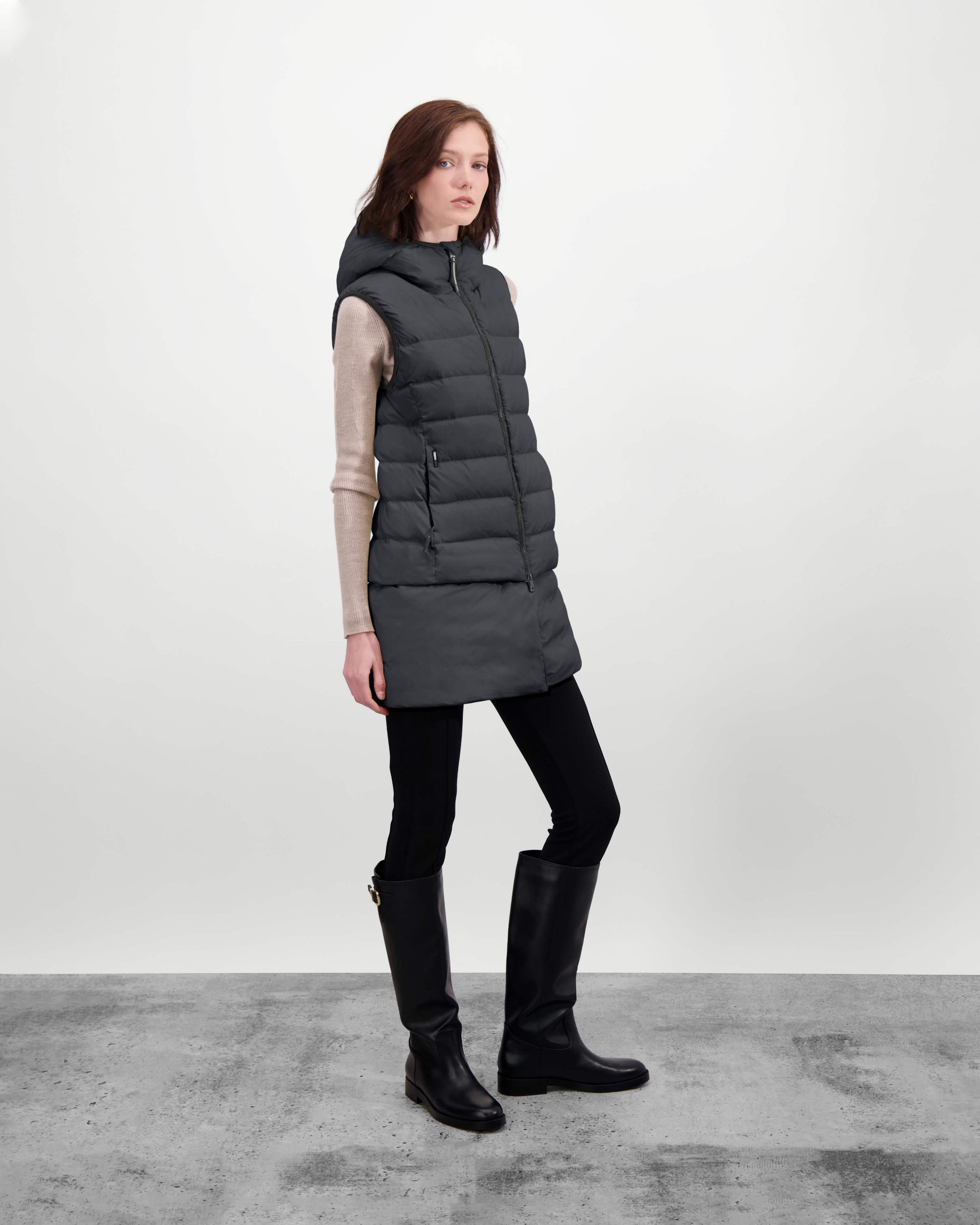 Saratoga puffer vest in Wheat insulated with Canadian white duck down, featuring stretch nylon ribbing for mobility, hidden waist drawcord, and a tailored fit for warmth and style. Lightweight and ideal for layering.