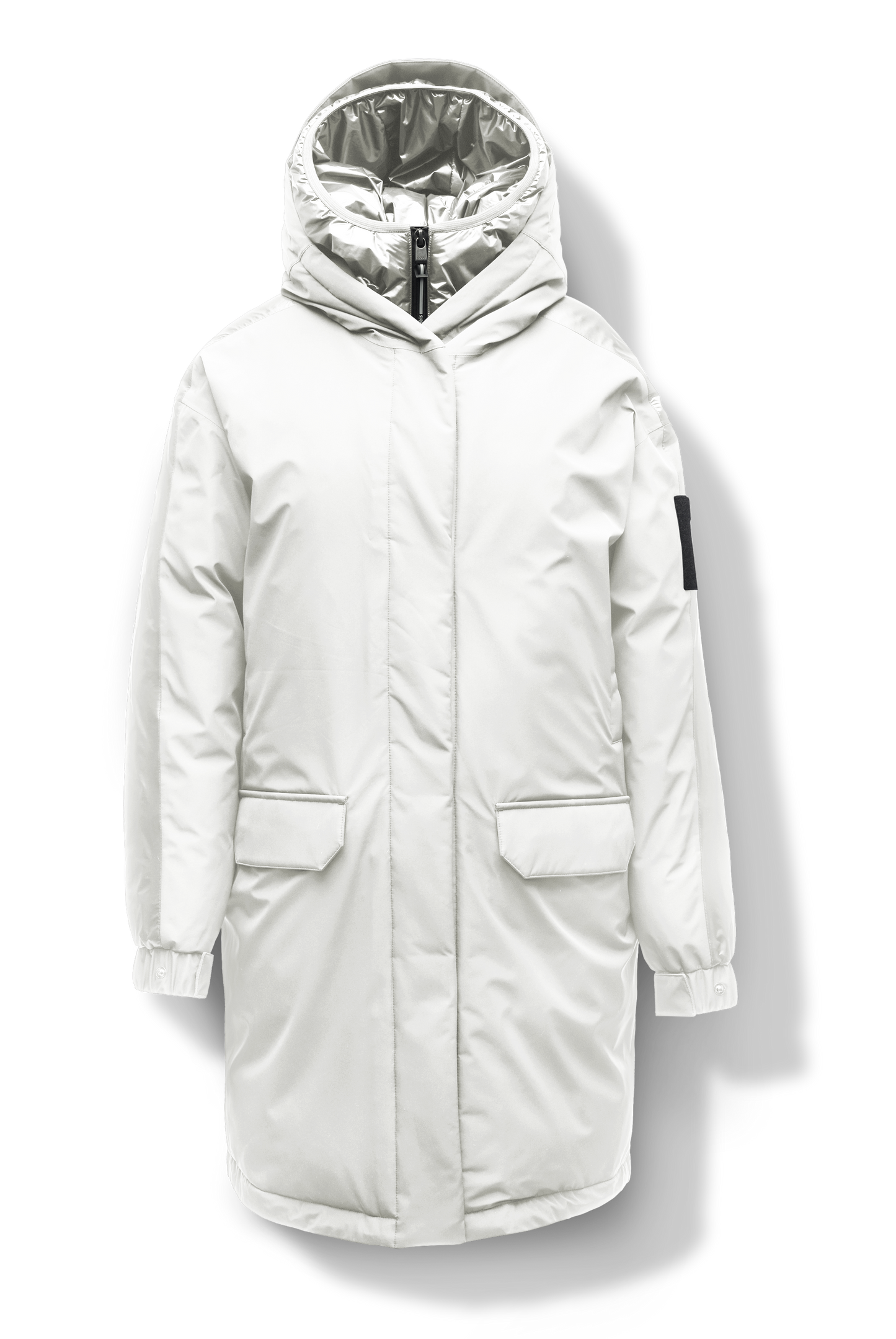 Slyn Women's Performance Parka in thigh length, premium 3-ply micro denier and cire technical nylon taffeta fabrication, Premium Canadian origin White Duck Down insulation, non-removable down-filled hood, inner hooded gilet, two-way centre-front zipper with magnetic closure wind flap, fleece-lined pockets at chest and waist, pit zipper vents, in Chalk
