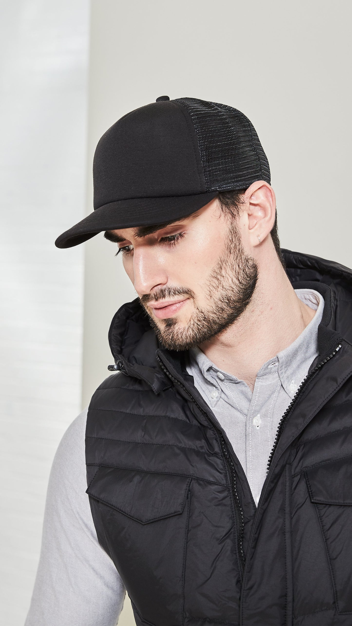 Six panel ball cap with two solid front panels and four mesh back panels in Black