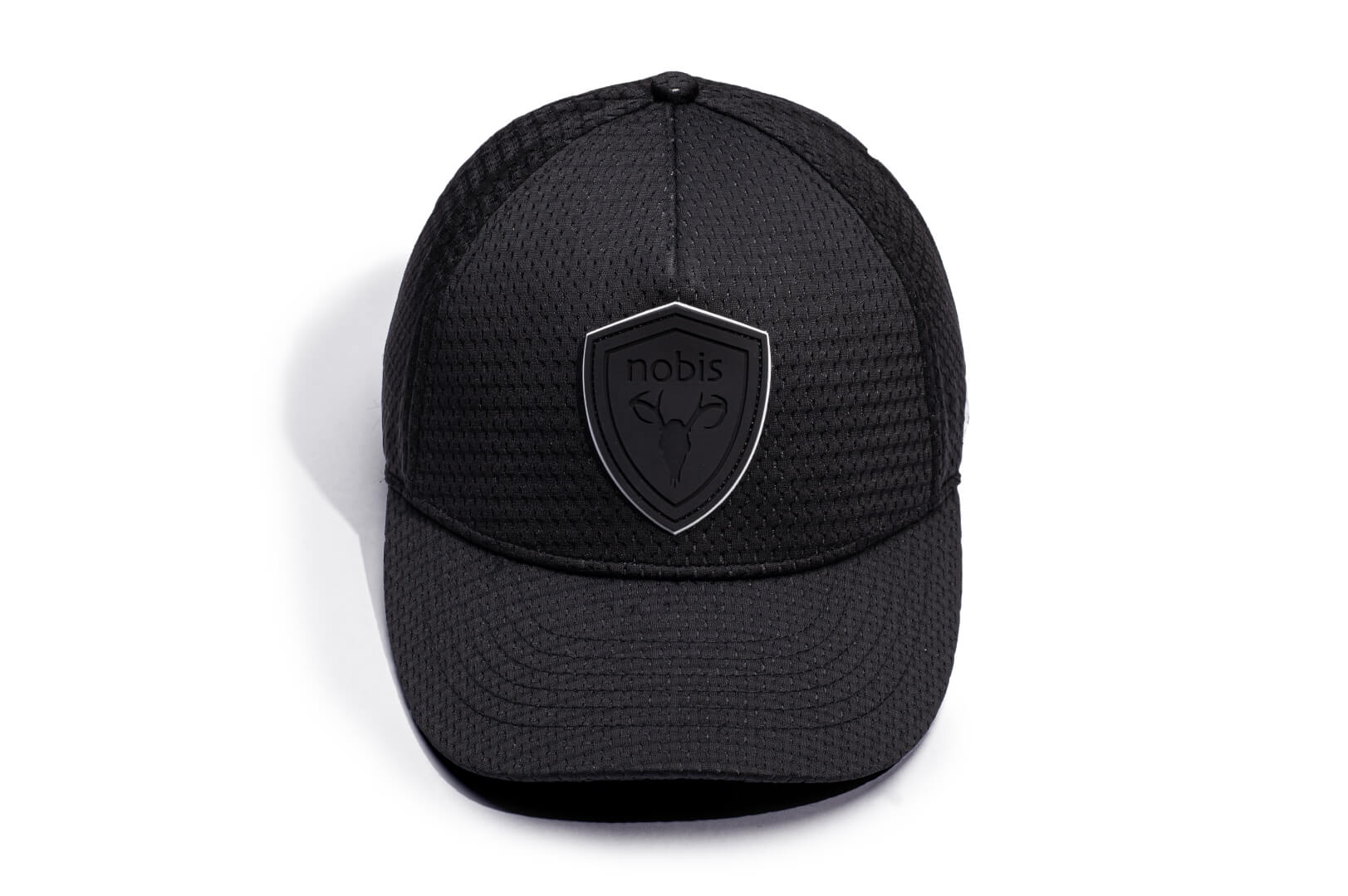 Ciryl Gane x Nobis 5-Panel Adjustable Cap in 5-panel jersey construction, curved brim, adjustable strap at back, tonal black Nobis shield logo attached on crown front, "Bon Gamin" embroidered on the left, and flag of France embroidered on the back, in Black
