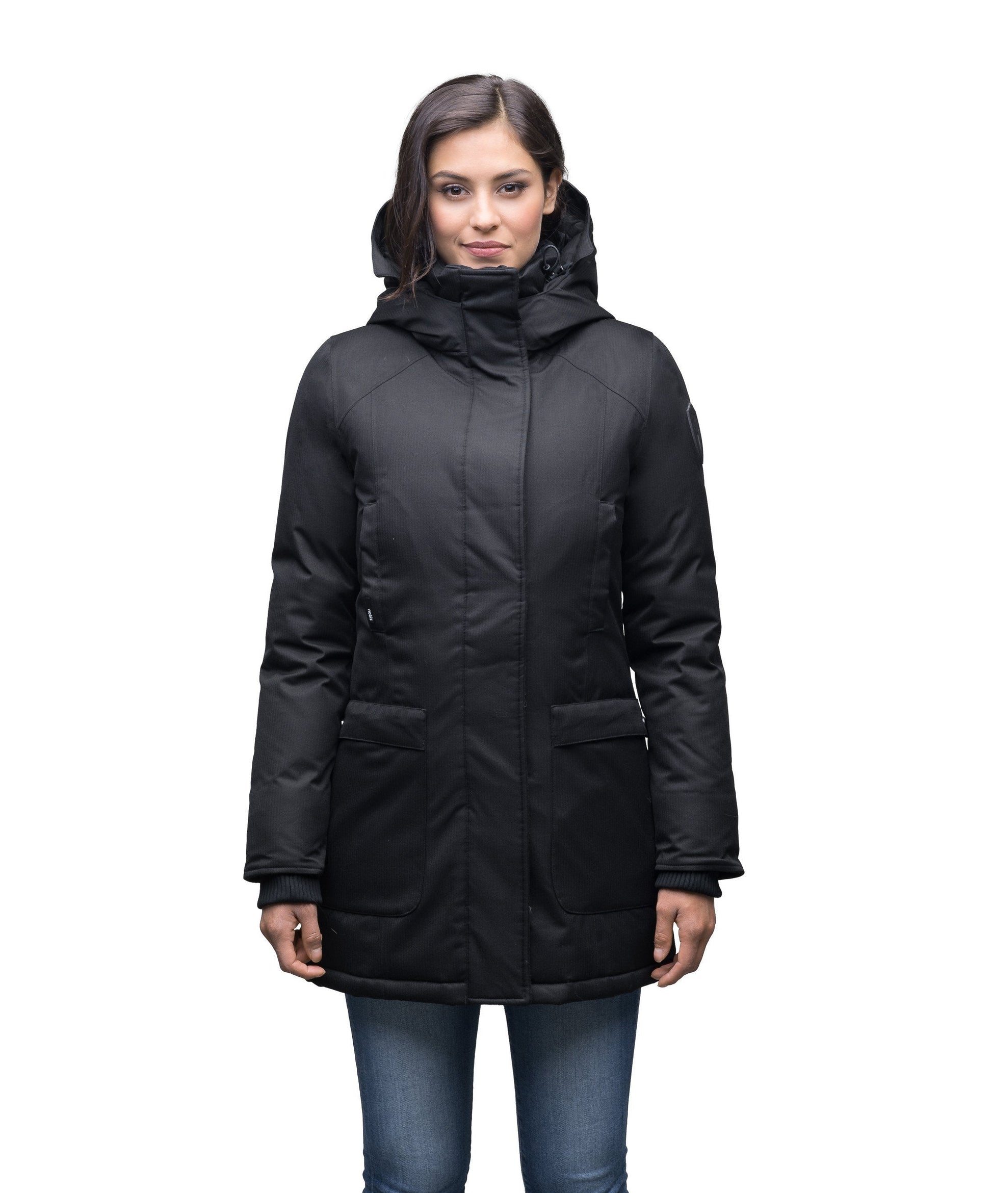 Carla Furless Ladies Parka in thigh length with Canadian Premium White Duck Down insulation, non-removable hood, centre-front zipper with magnetic closure wind flap, and four exterior pockets, in Black
