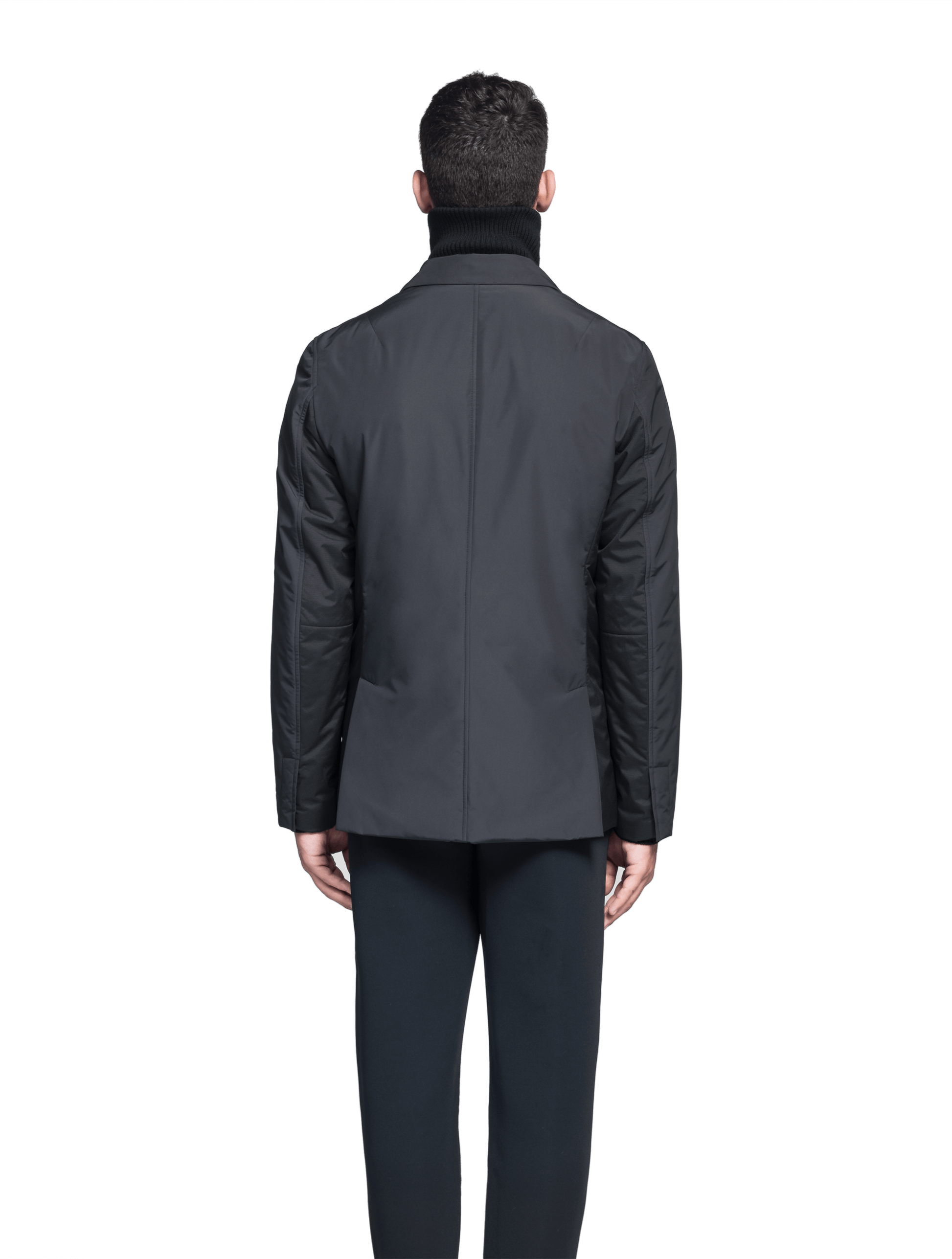 Cody Men's Tailored Travel Blazer in 3-ply micro denier and stretch nylon fabrication with DWR coating, Primaloft Gold Insulation Active+, hidden two-way zipper at centre front with snap closure placket, three invisible exterior zipper pockets, double back pleats, and hidden snap placket at cuffs, in Black