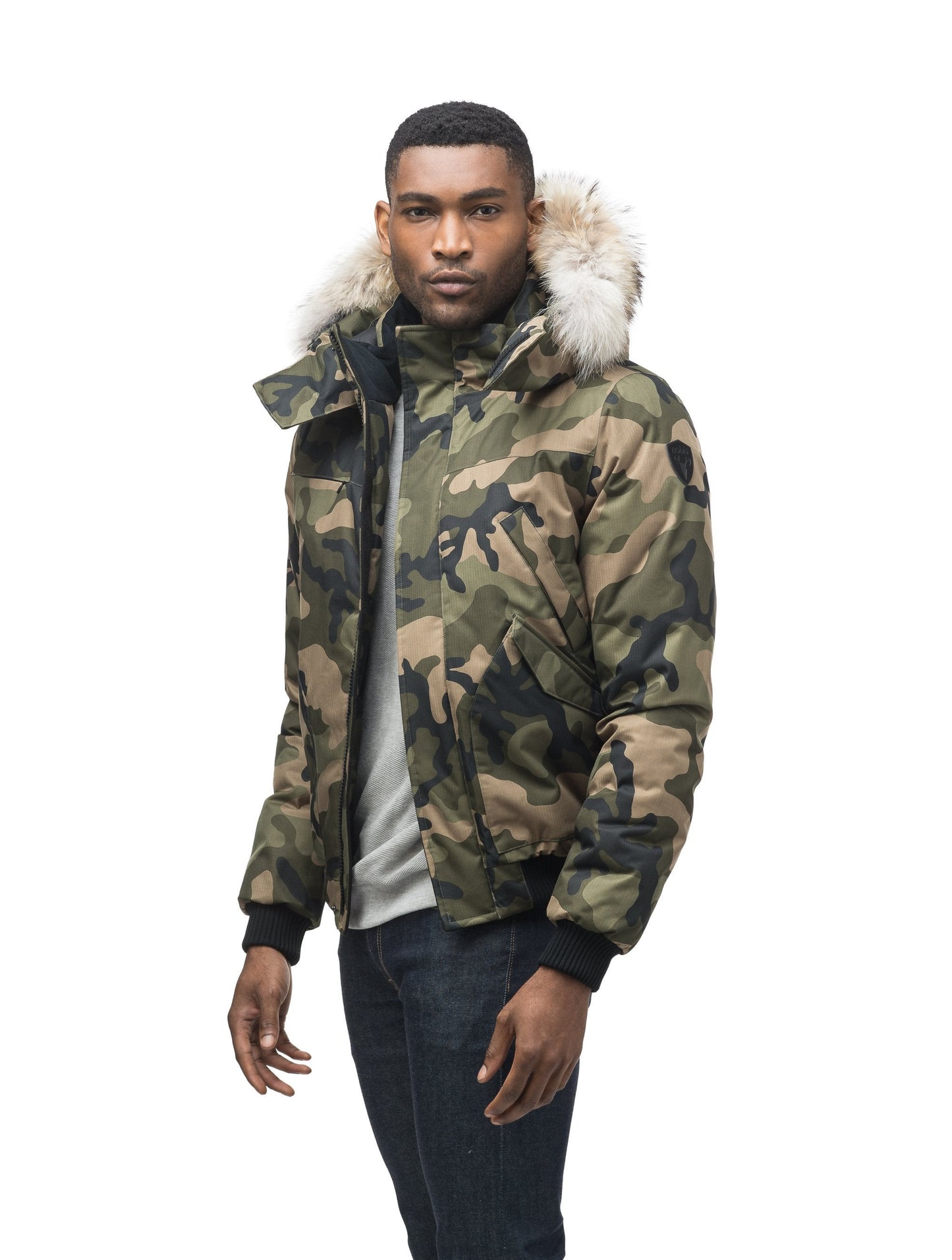 Men's classic down filled bomber jacket with a down filledÂ hood that features a removable coyote fur trim and concealed moldable framing wire in Camo