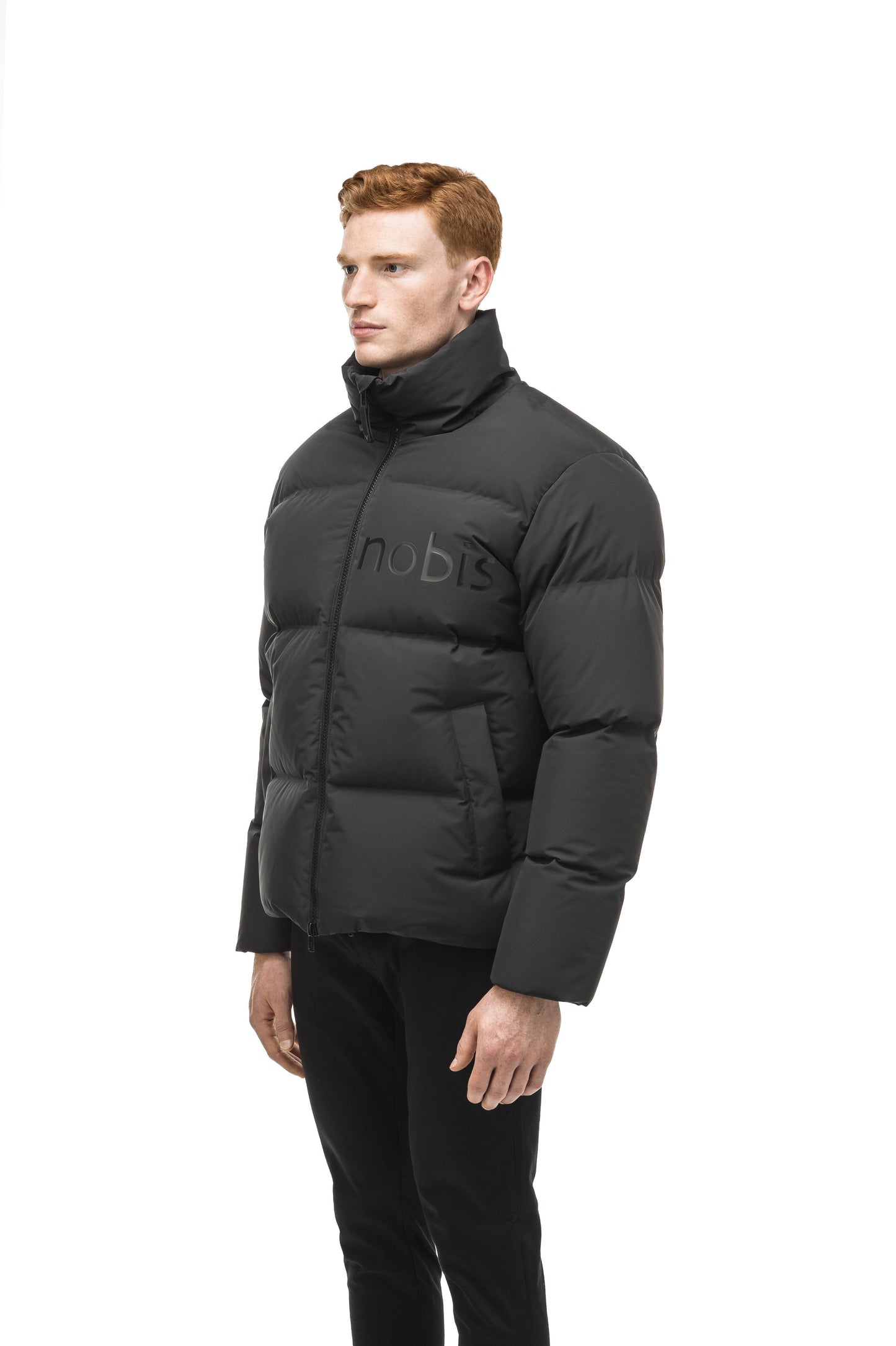 Men's puffer jacket with a minimalist modern design; featuring graphic details like oversized tonal branding, an exposed zipper, and seamless puffer channels in Black