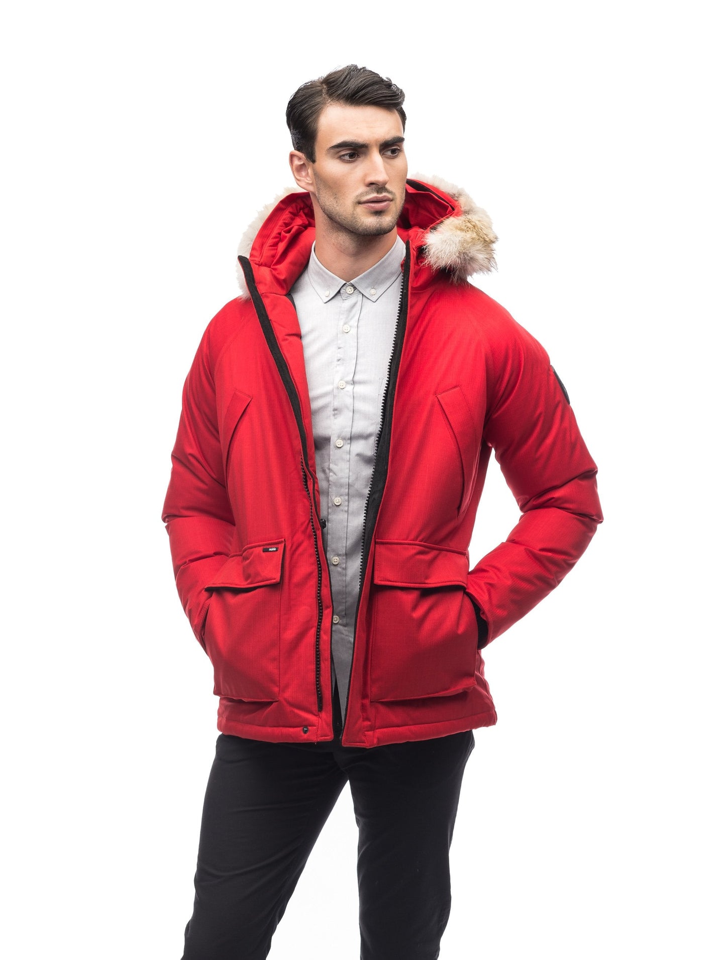 Men's waist length down filled jacket with two front pockets with magnetic closure and a removable fur trim on the hood in CH Red