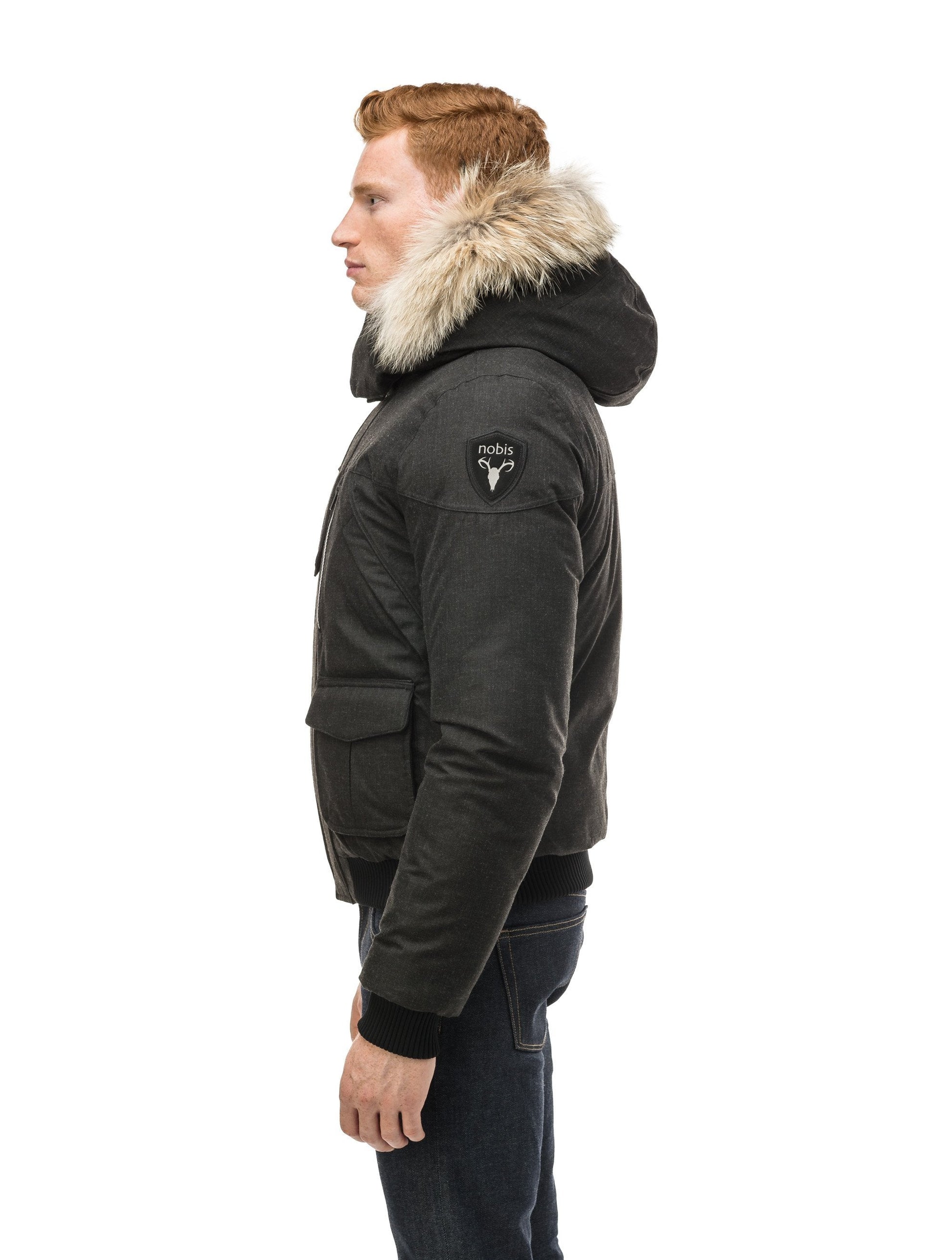 Men's classic down bomber with two patch pockets and a right shoulder storm flap in H. Black