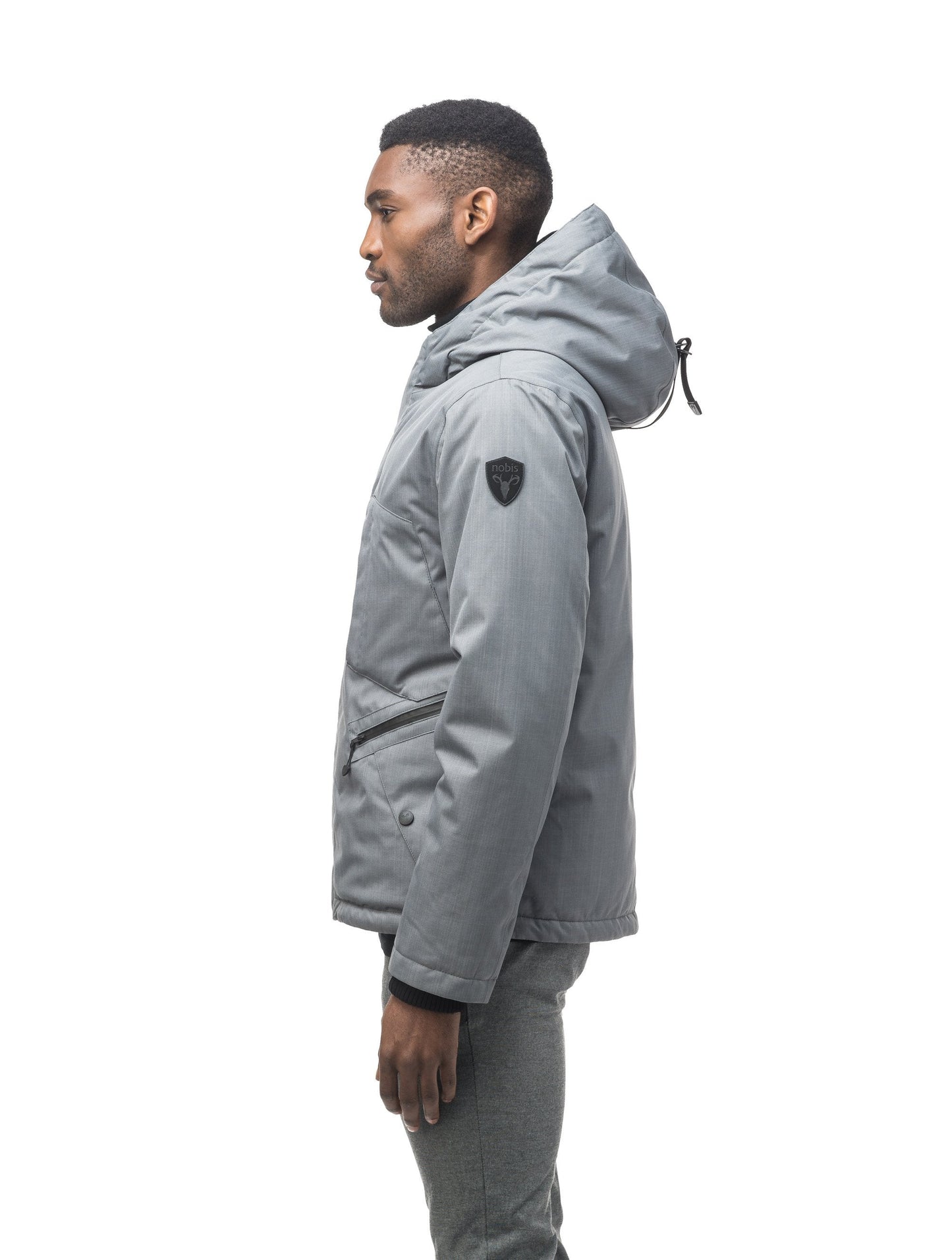 Men's waist length light down coat equipped with six exterior pockets and a hood in Concrete