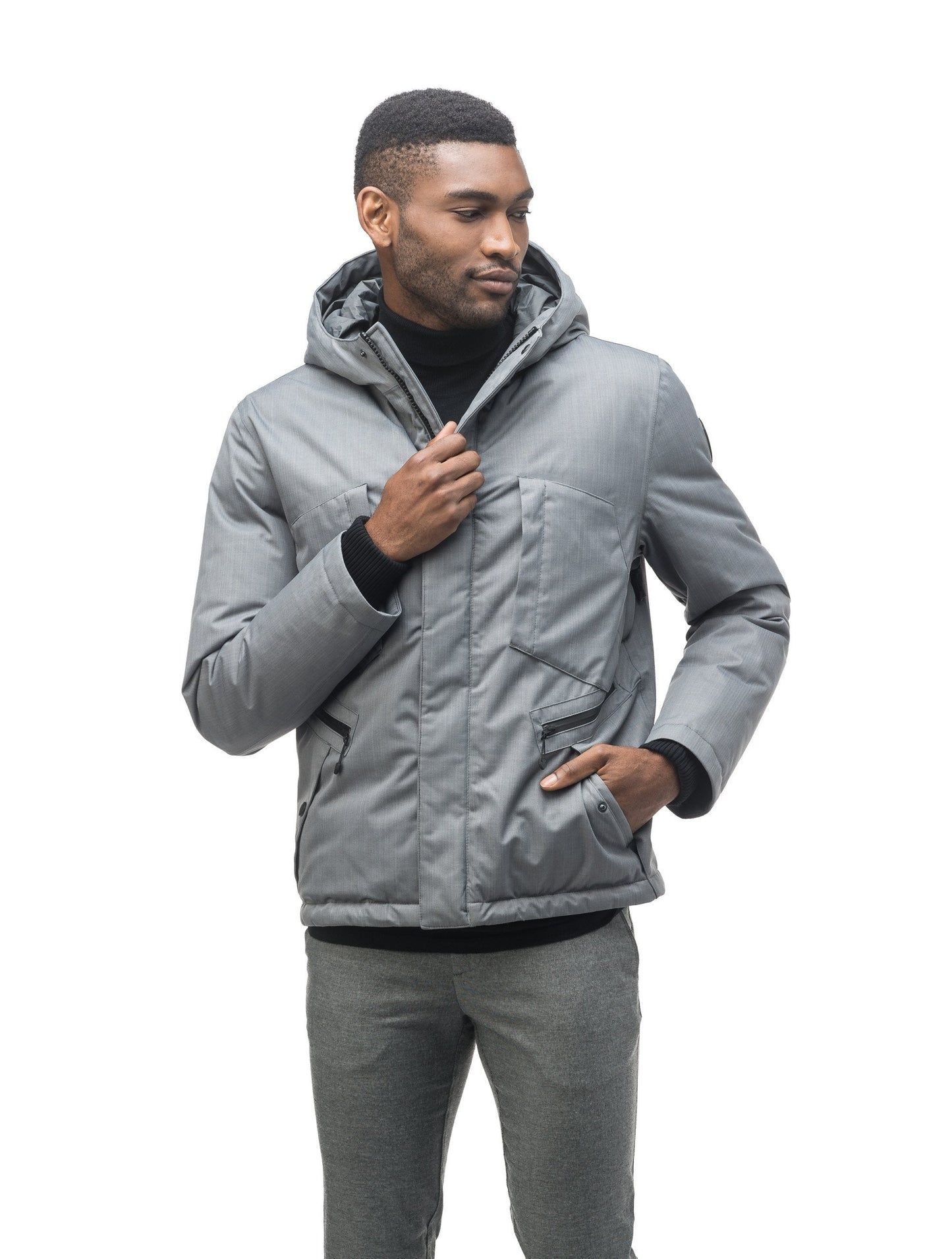 Men's waist length light down coat equipped with six exterior pockets and a hood in Concrete