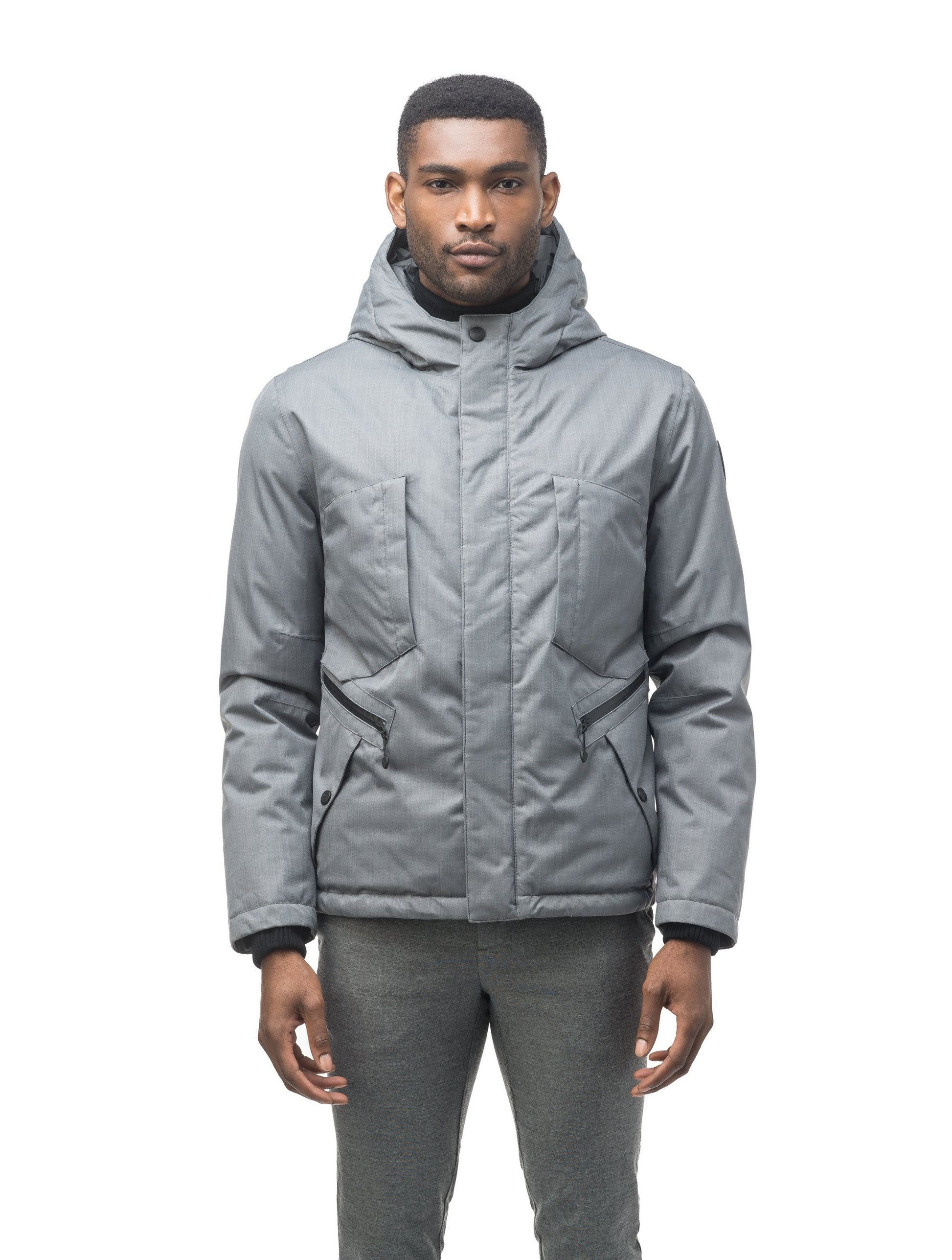 Men's waist length light down coat equipped with six exterior pockets and a hood in Concrete