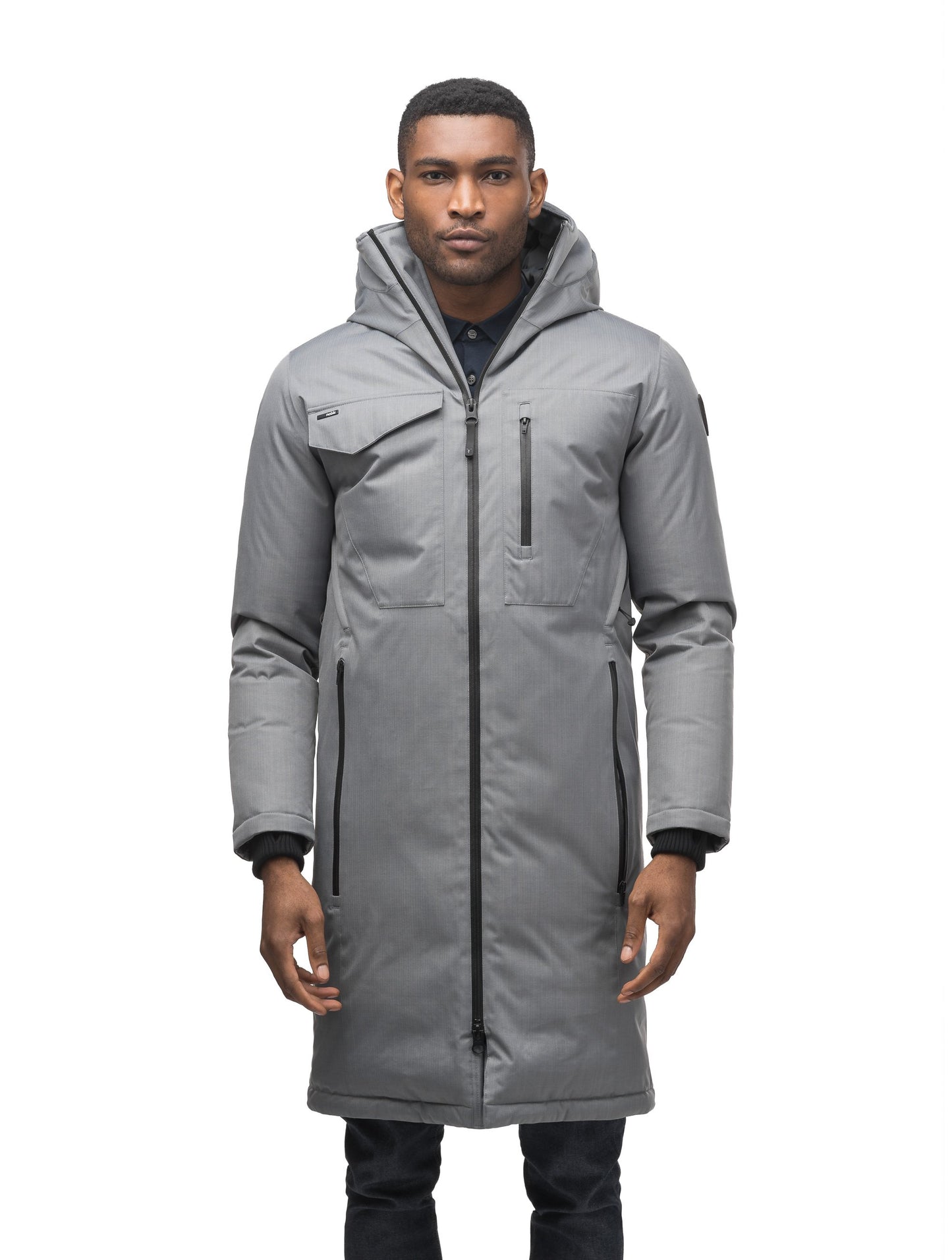 Long men's calf length parka with down fill and exposed zipper that features spacious pockets and zippered vents in Concrete