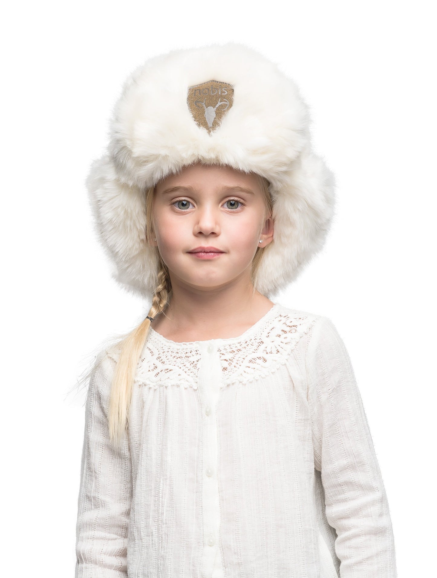 Plush faux fur trapper hat with a khaki suede Nobis patch on the front of the brim in White