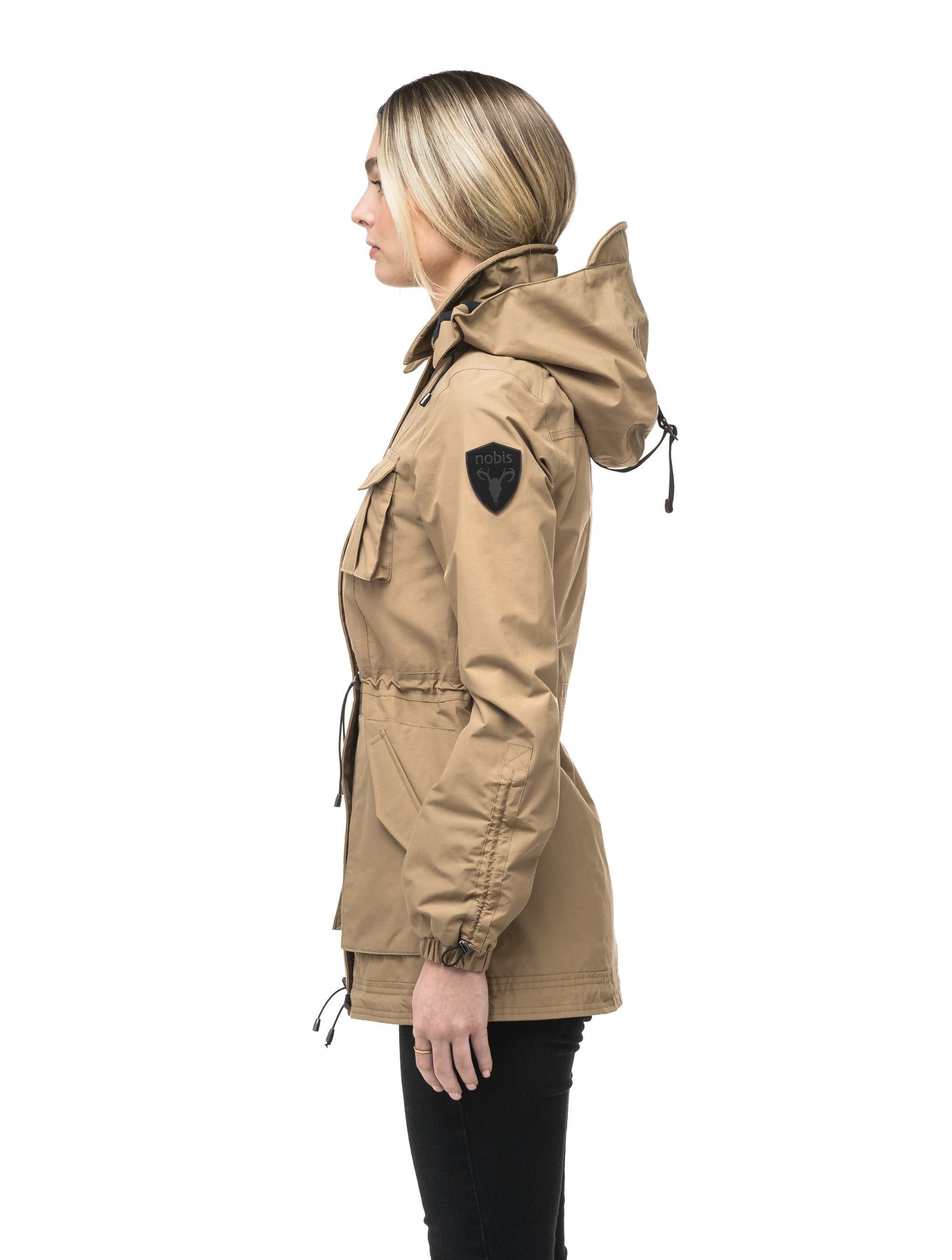 Women's hooded shirt jacket with four front pockets and adjustable waist in Tan