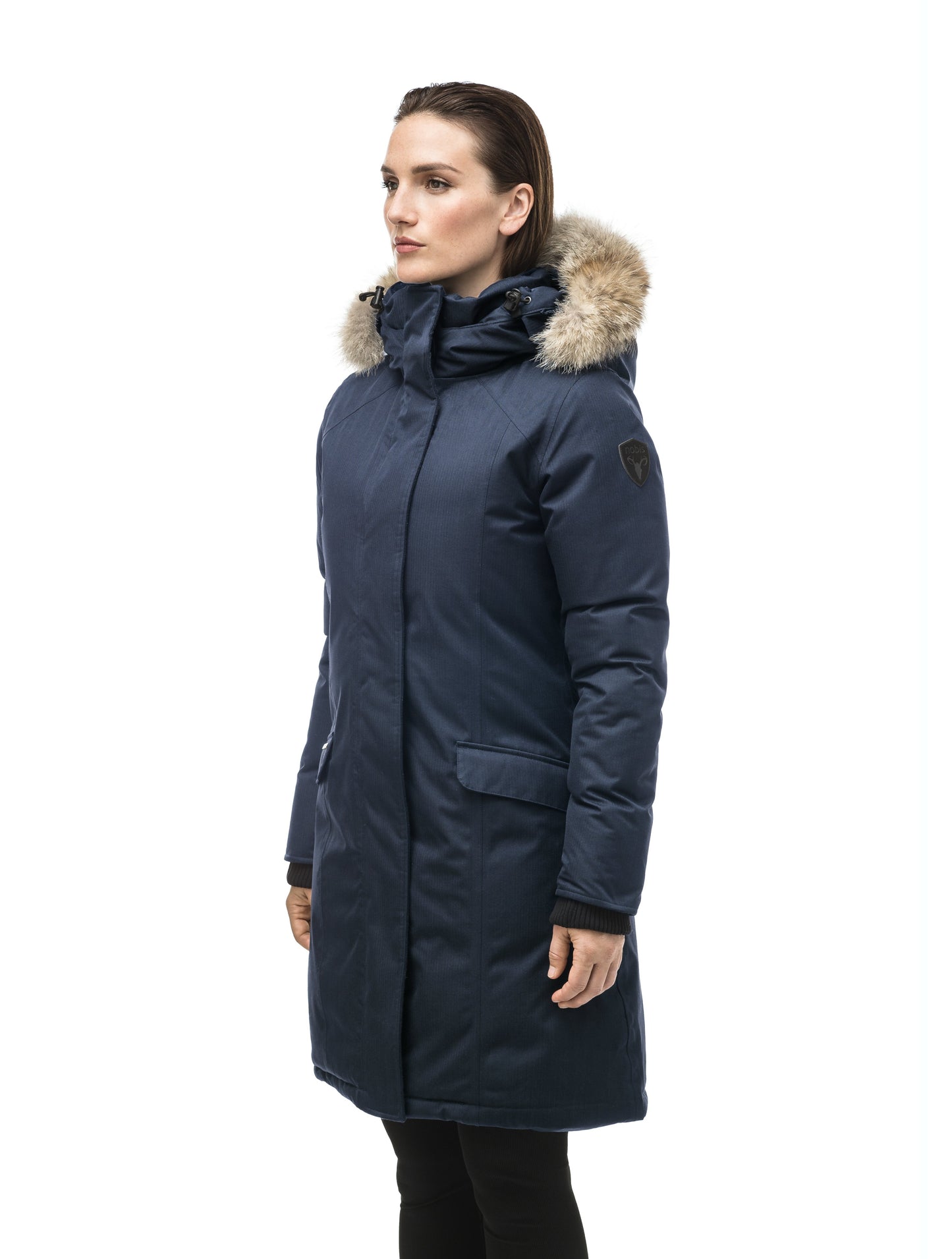 Rebecca Women's Parka in knee length, Canadian duck down insulation, two-way zipper with magnetic front placket, non-removable hood with removable coyote fur trim, in Navy