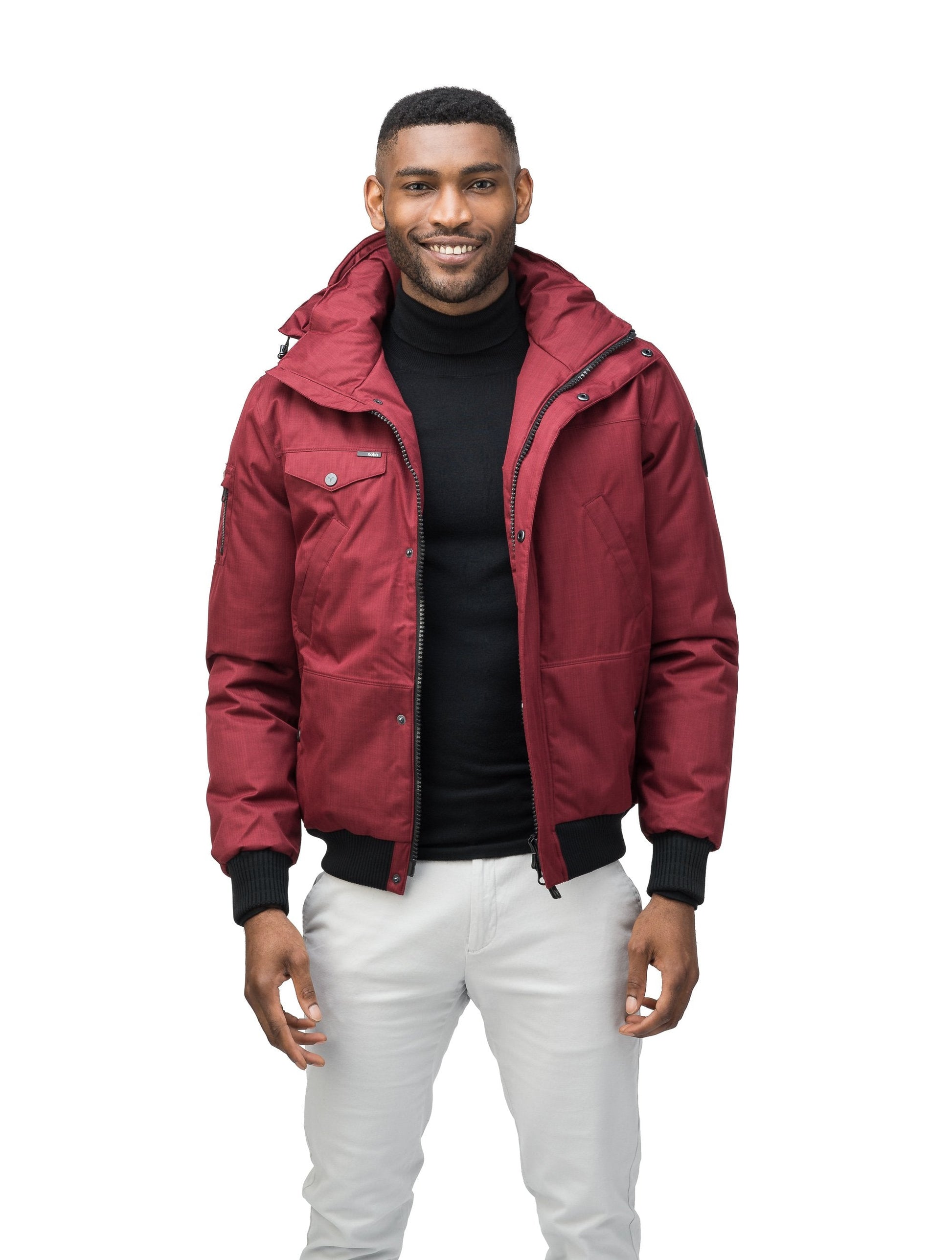 Men's sleek down filled bomber jacket with clean details and a fur free hood in CH Cabernet
