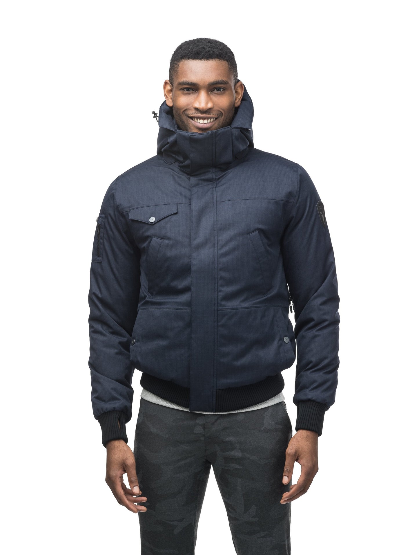 Men's sleek down filled bomber jacket with clean details and a fur free hood in CH Navy