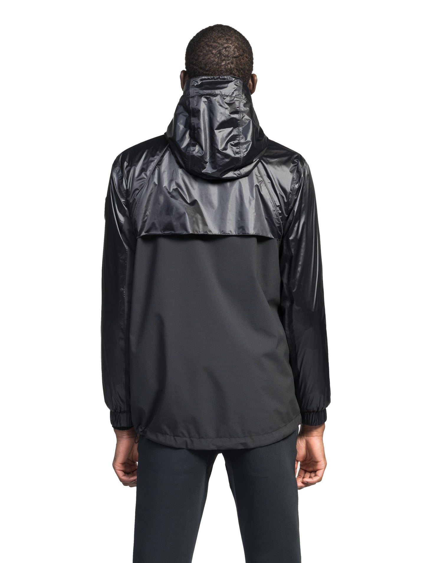 Stratus Men's Tailored Packable Rain Jacket in hip length, premium cire technical nylon taffeta and stretch ripstop fabrication, highly breathable mesh lining, hidden packable pocket, non-removable hood with adjustable draw cord, reflective piping along front and back, underarm grommets for extra breathability, back yoke with mesh ventilation, two waist zipper pockets, two interior zipper pockets, elastic cuffs with adjustable snap button, and adjustable interior draw cord at waist hem, in Black