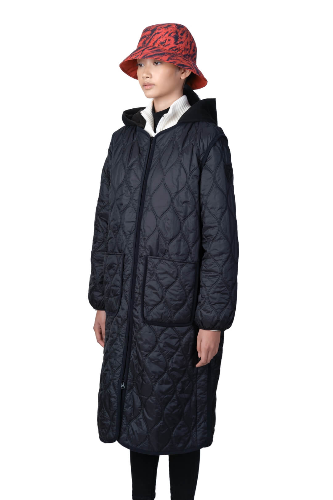 Lunar New Year Ladies Quilted Long Jacket in knee length, sustainable and environmentally friendly Primaloft Gold Insulation Active+, with removable fleece hood, two-way front zipper, two waist patch pockets, and diamond quilted body, in Black