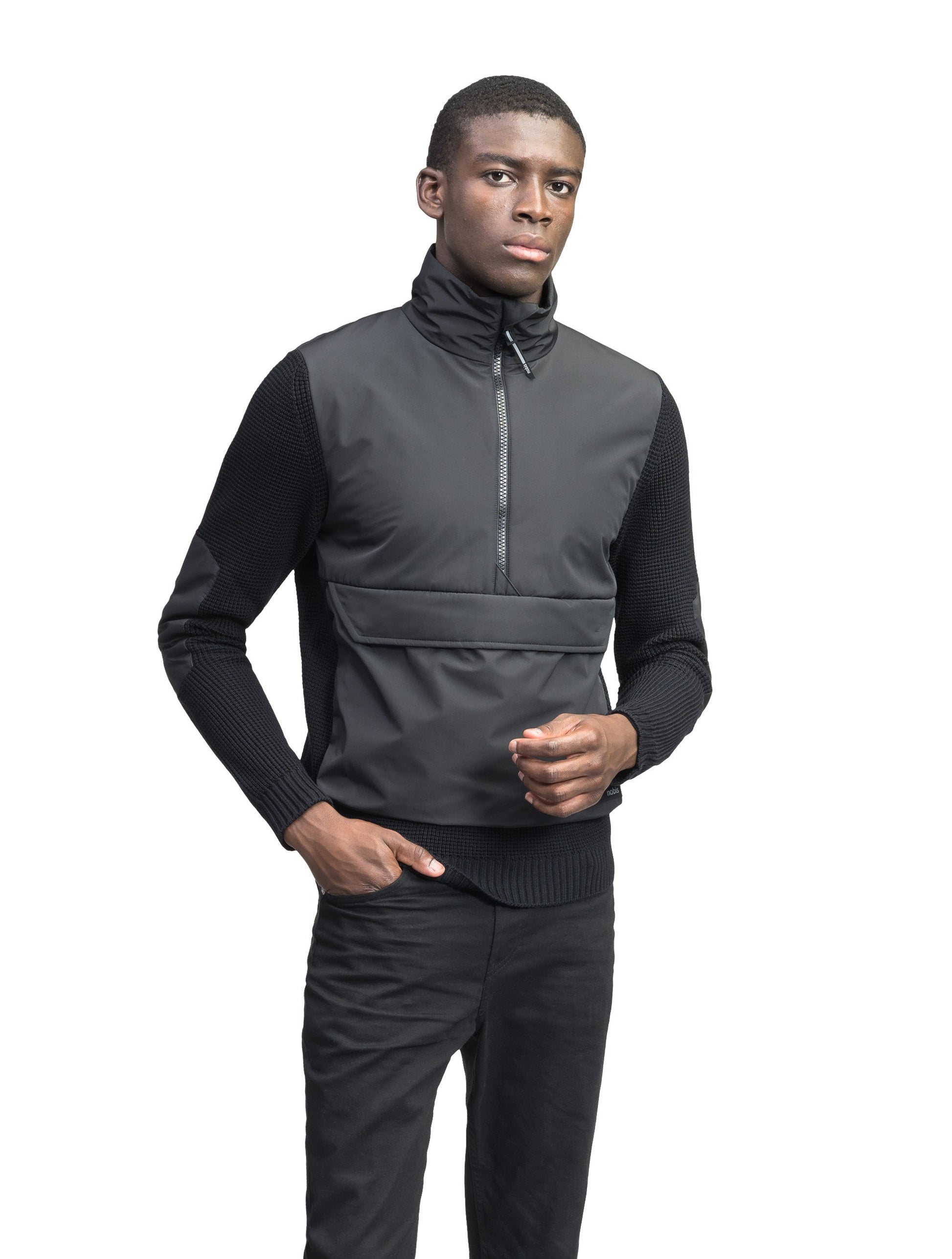 Wai Men's Performance Half Zip Sweater in hip length, 3-Ply Micro Denier and Merino wool knit fabrication, Primaloft Gold Insulation Active+, centre front zipper, flap kangaroo pocket with magnetic closure, and hidden side-entry zipper pockets at waist, in Black
