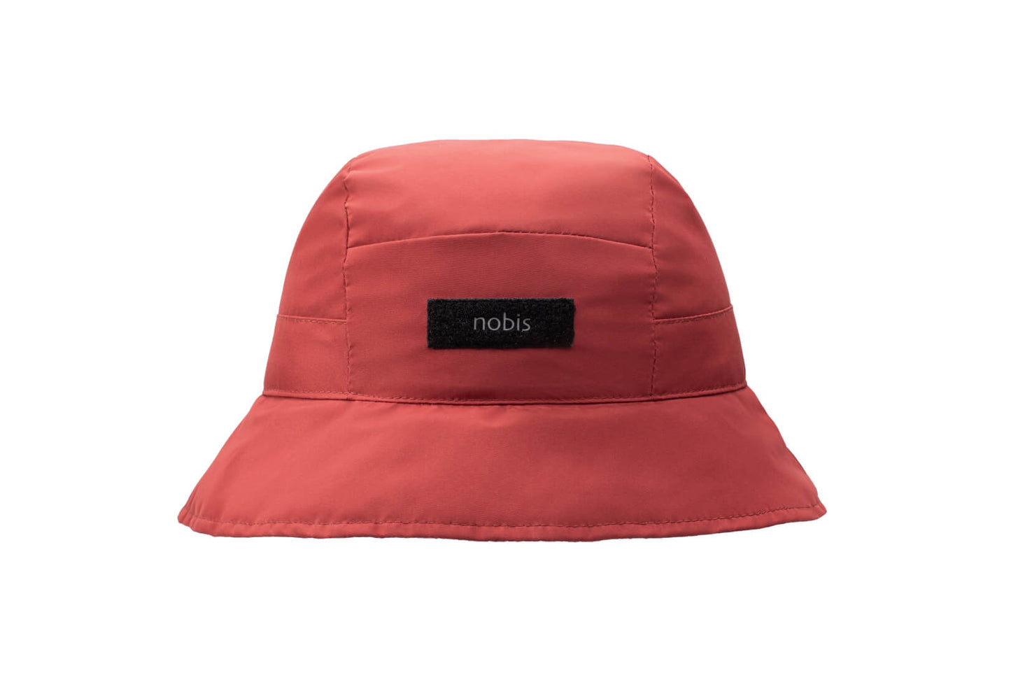 Lunar New Year Reversible Bucket Hat with one side in red tiger print, and the reverse side in tonal red with Nobis label branding on the crown front, in Vermillion